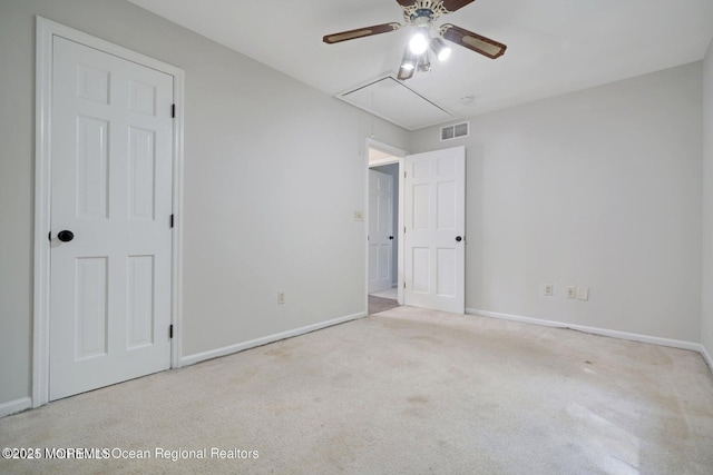 unfurnished bedroom featuring ceiling fan and light colored carpet