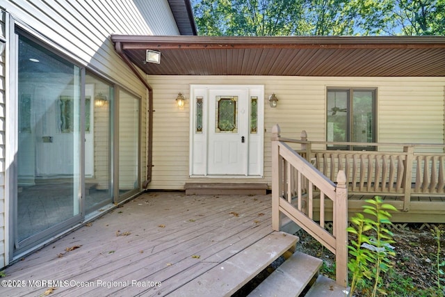 doorway to property with a wooden deck