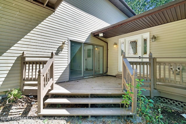 doorway to property featuring a wooden deck