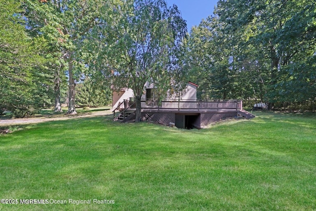 view of yard featuring a wooden deck