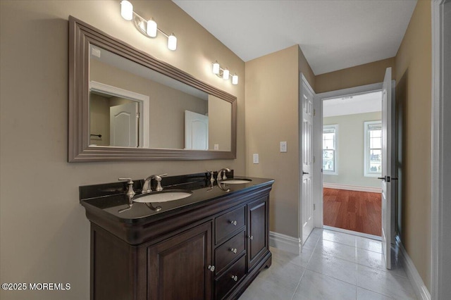 bathroom featuring tile patterned flooring and vanity