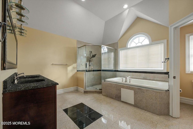 bathroom featuring vanity, plus walk in shower, and lofted ceiling