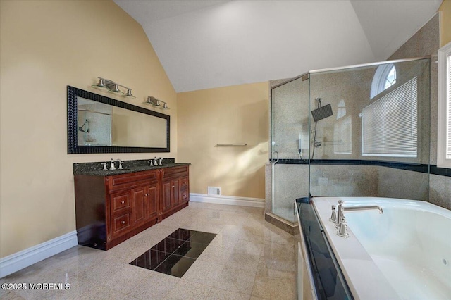 bathroom featuring vanity, separate shower and tub, and vaulted ceiling