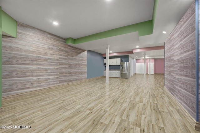 unfurnished living room featuring light hardwood / wood-style floors