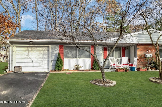 ranch-style house with a front yard, a porch, and a garage