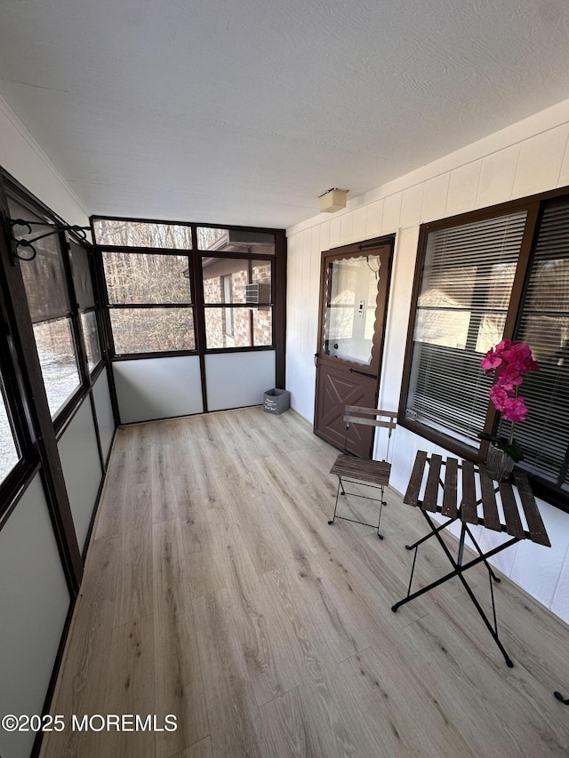 unfurnished sunroom with plenty of natural light