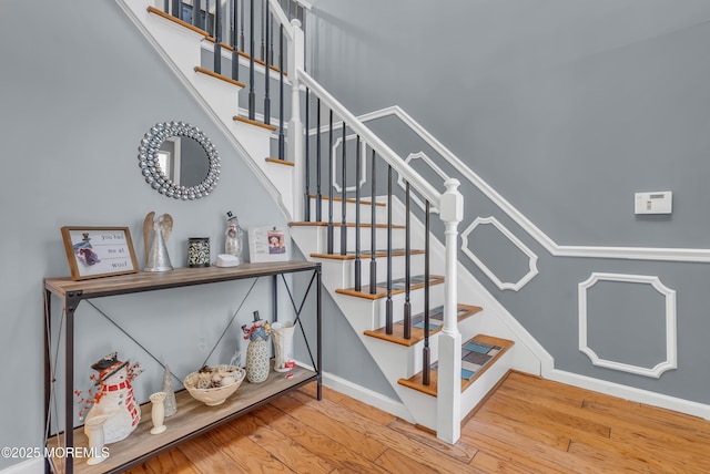 stairs with hardwood / wood-style flooring