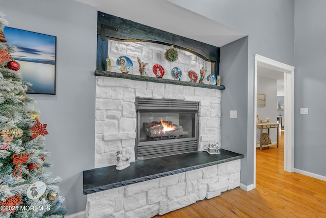 room details featuring hardwood / wood-style floors and a fireplace