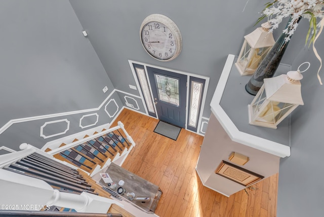 entryway with hardwood / wood-style flooring