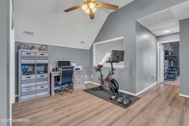 office featuring ceiling fan, light wood-type flooring, and vaulted ceiling