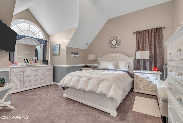 bedroom with carpet and lofted ceiling