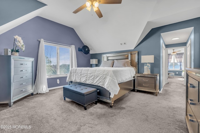 carpeted bedroom featuring ceiling fan and vaulted ceiling