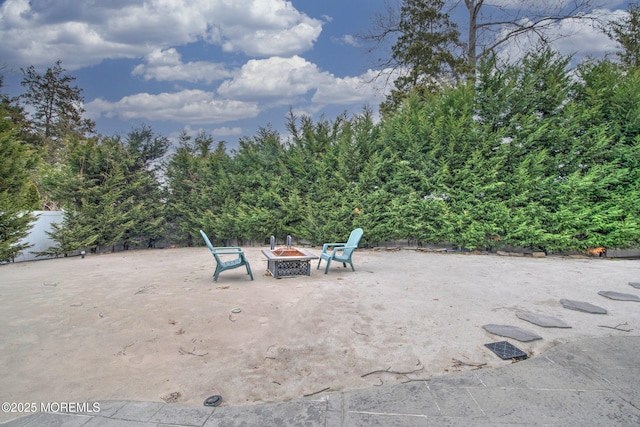 view of patio featuring an outdoor fire pit