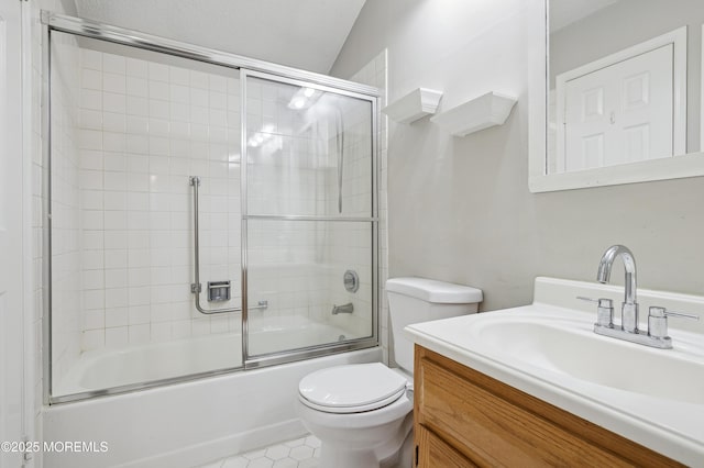 full bathroom with toilet, combined bath / shower with glass door, tile patterned flooring, and vanity