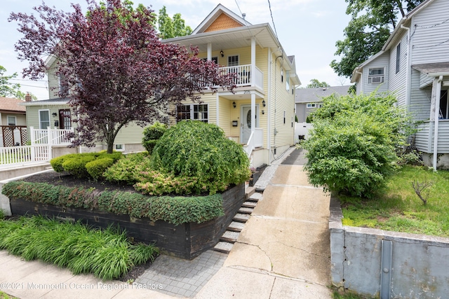 view of front of home featuring a balcony