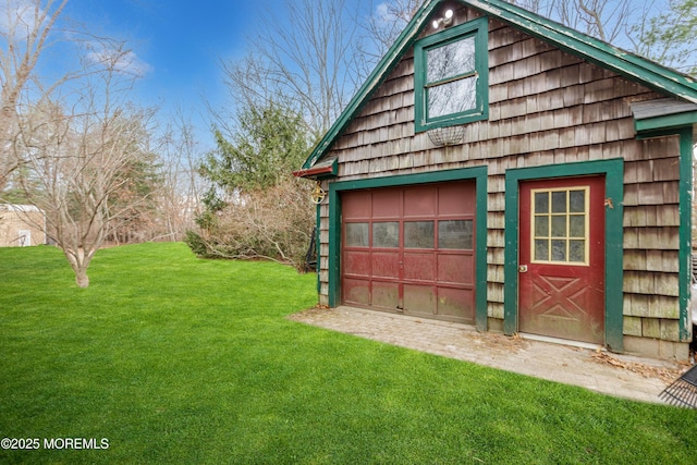 garage with a lawn