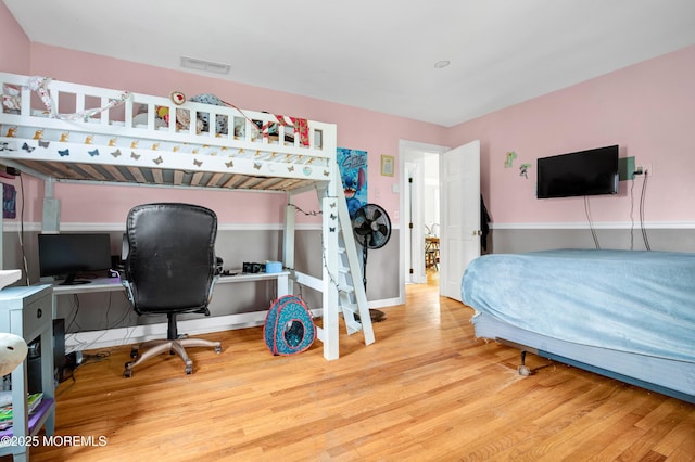 bedroom featuring hardwood / wood-style floors