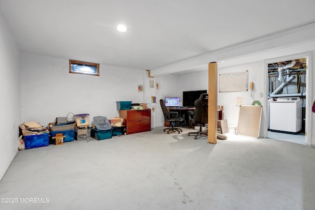 office with washer / clothes dryer and concrete floors