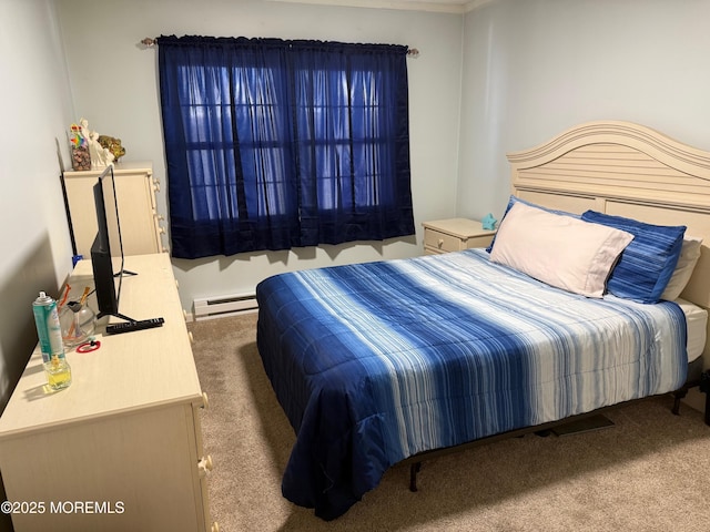 bedroom with carpet floors and baseboard heating