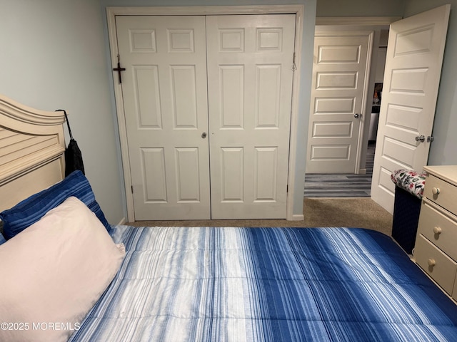 unfurnished bedroom featuring dark carpet and a closet