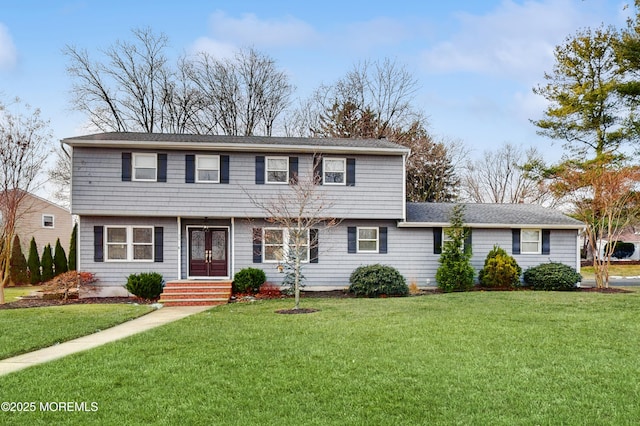 view of front of property with a front lawn