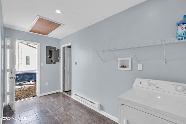 laundry room featuring washer / clothes dryer, a baseboard radiator, dark tile patterned floors, and electric panel