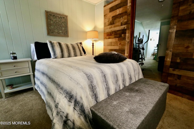 carpeted bedroom with wooden walls