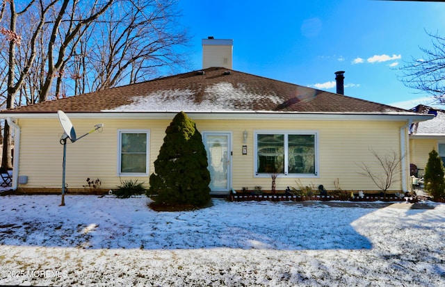 view of snow covered house