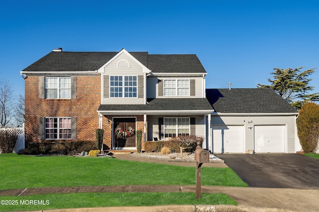 view of front facade with a front yard and a garage