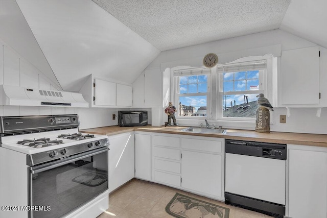 kitchen with a textured ceiling, white appliances, ventilation hood, white cabinets, and lofted ceiling