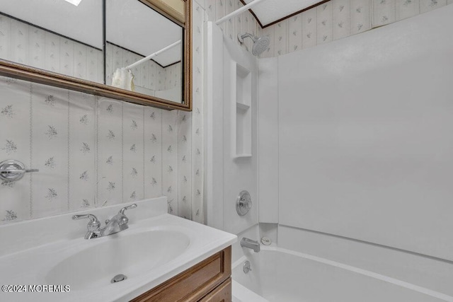 bathroom featuring vanity and shower / washtub combination