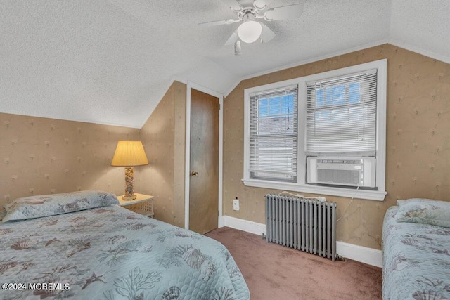 carpeted bedroom with ceiling fan, radiator heating unit, cooling unit, and lofted ceiling