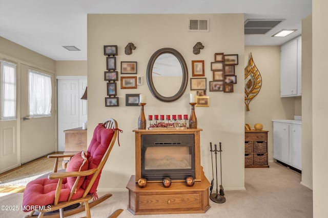 sitting room with light colored carpet