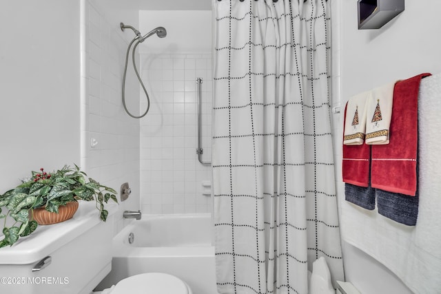 bathroom featuring toilet and shower / bath combination with curtain