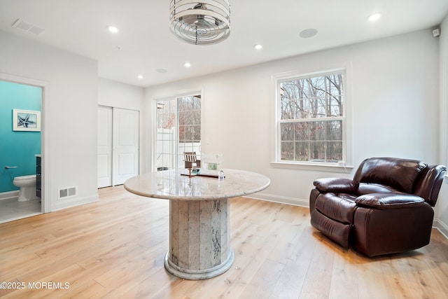 living area with light hardwood / wood-style floors