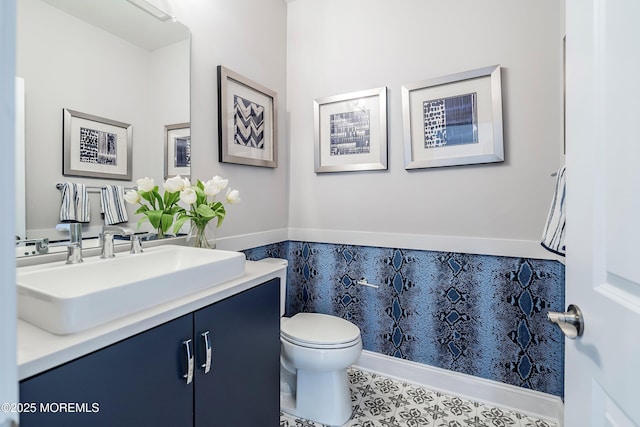 bathroom with vanity, tile patterned floors, and toilet