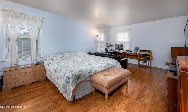 bedroom featuring wood-type flooring