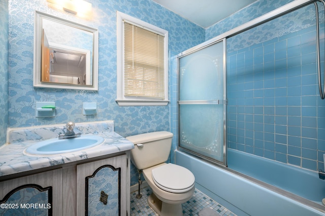 full bathroom with tile patterned floors, enclosed tub / shower combo, toilet, and vanity