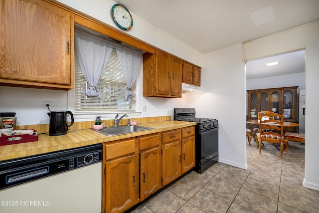 kitchen featuring light tile patterned flooring, gas stove, dishwasher, and sink