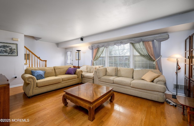 living room with light hardwood / wood-style floors