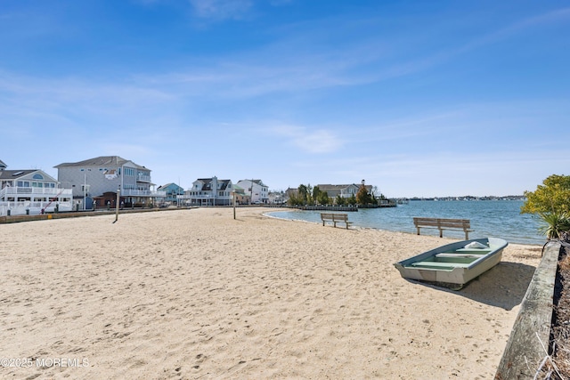 view of community with a residential view, a water view, and volleyball court