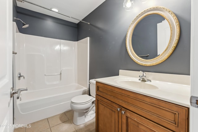 bathroom featuring washtub / shower combination, tile patterned flooring, vanity, and toilet