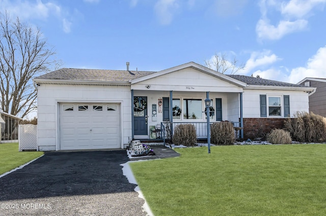 ranch-style home with a porch, a garage, and a front lawn