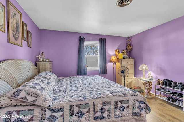 bedroom featuring wood-type flooring