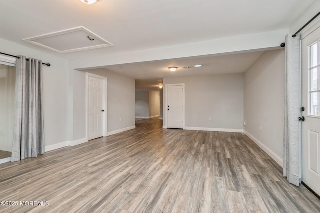 empty room with light hardwood / wood-style floors