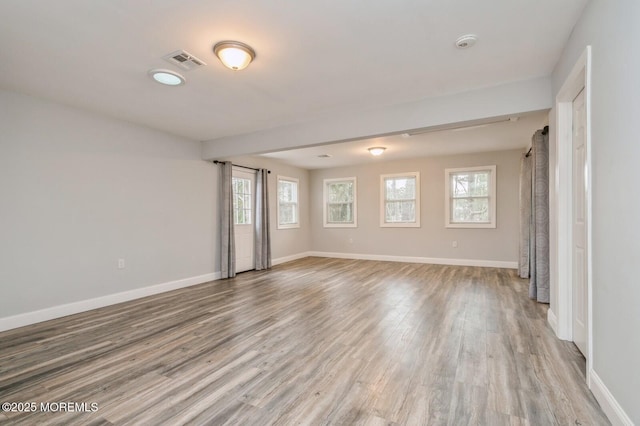 spare room with light hardwood / wood-style flooring