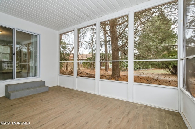 unfurnished sunroom featuring wooden ceiling