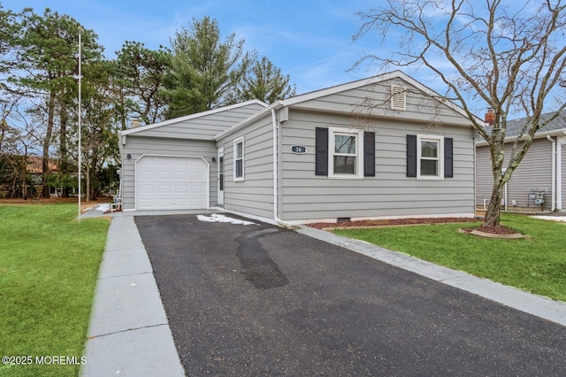 view of front facade with a garage and a front lawn