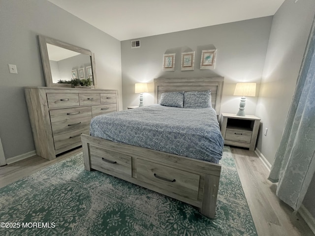 bedroom with hardwood / wood-style floors