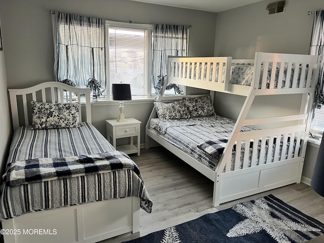 bedroom with hardwood / wood-style flooring